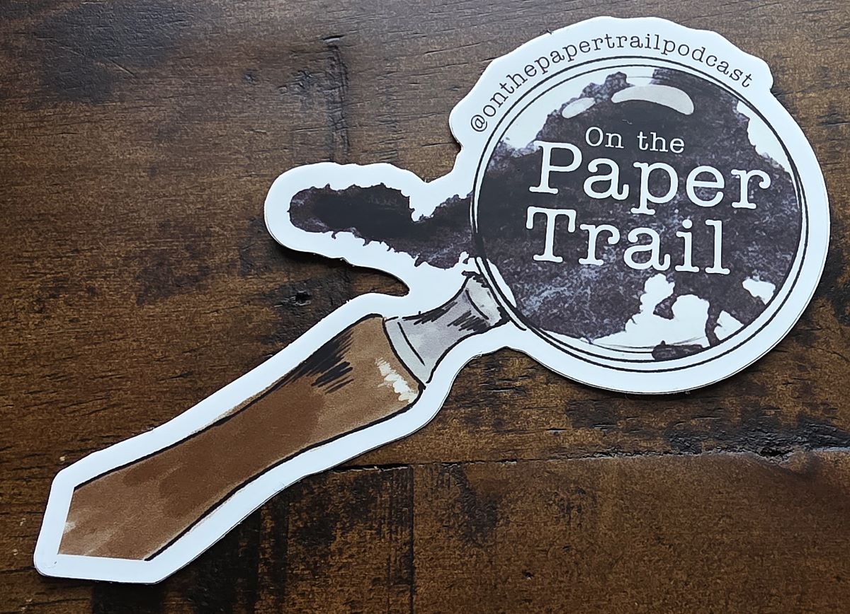 A magnifying glass sticker for the On the Paper Trail podcast