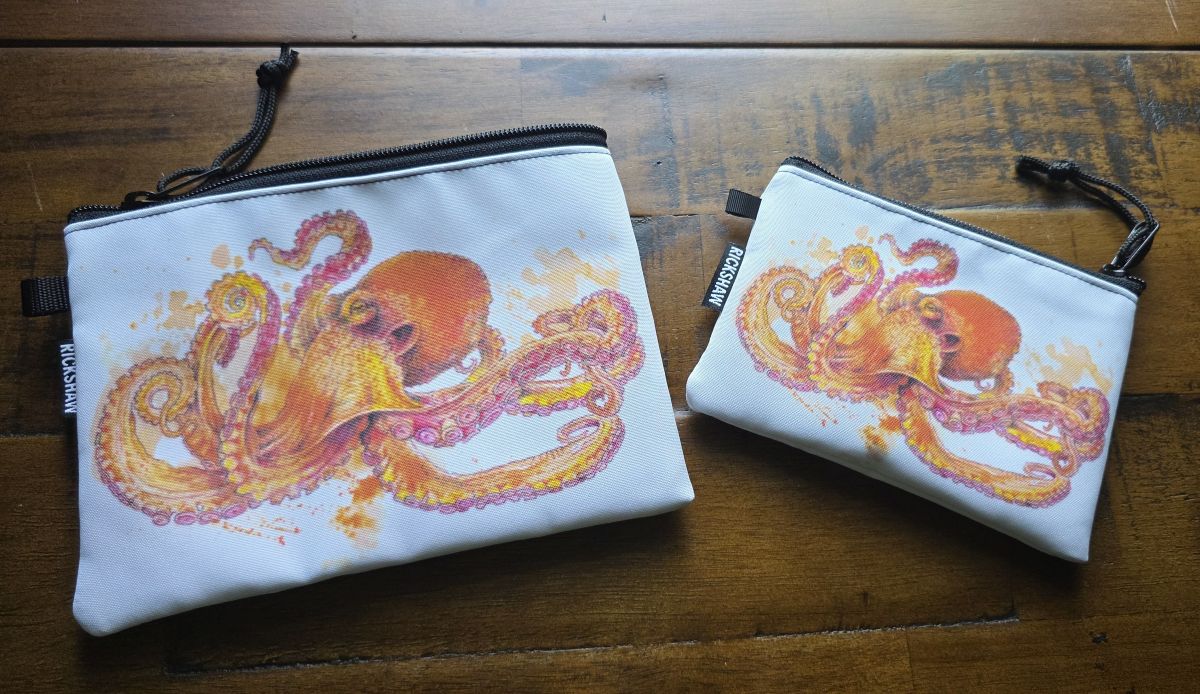 Small and medium zipper pouches from Rickshaw with a painted octopus art design from Abdiel Acosta.