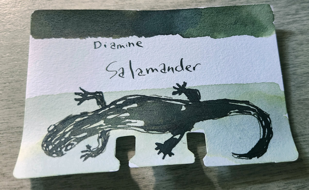 A Col-o-dex card with a swatch of the dark shading green of Diamine Salamander with a sketch of a salamander.