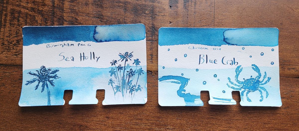 Two Col-o-dex ink swatch cards for Birmingham Pen Company Sea Holly, a medium dark blue, and Colorverse Blue Crab, a medium blue.