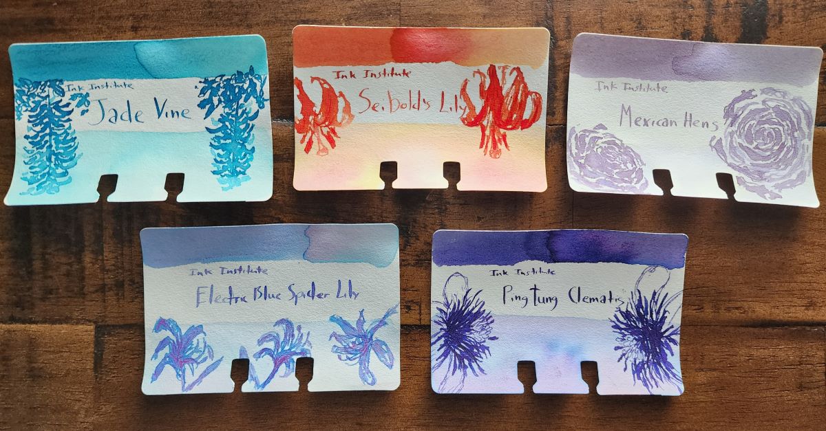 Five Col-o-dex ink swatch cards with sketches of flowers for Ink Institute inks Jade Vine, a blue-green, Seibold's Lily, a chromashading pink orange, Mexican Hens, a dusty pale purple, Electric Blue Spider Lily, a chromashading blue, purple, and pink, and Pingtung Clematis, a dark purple.