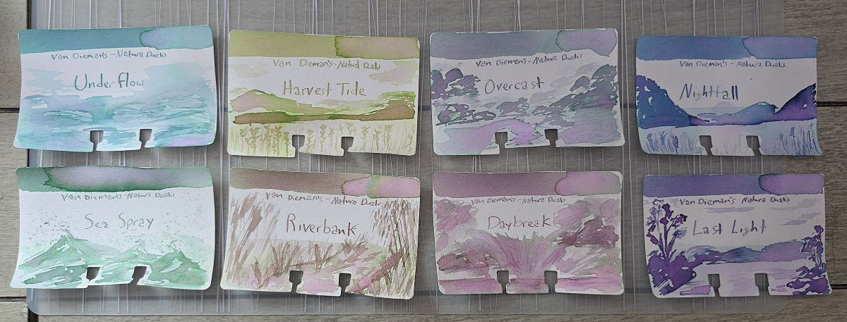 Eight Col-o-dex ink swatch cards with sketches for the Van Dieman's Natura Dualis inks Underflow, Sea Spray, Harvest Tide, Riverbank, Overcast, Daybreak, Nightfall, and Last Light. 