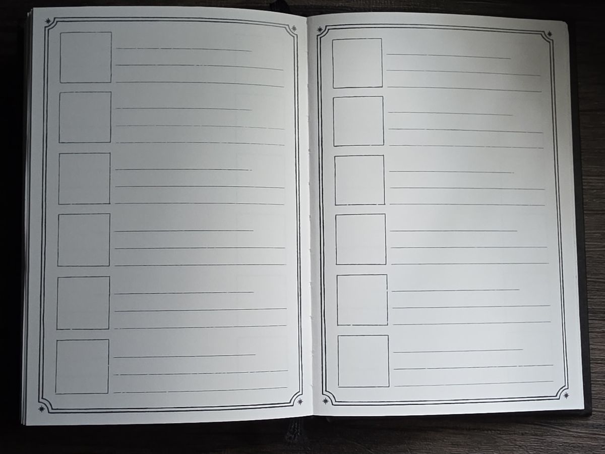 Ink Archiving book open to a page with a square box to the left of three lines repeated six times per page, and a fancy border around the edge of the page.