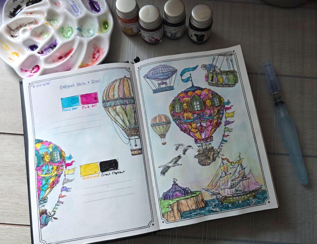 Ink Archiving book open to a page with black outline illustrations of several fantastical hot air balloons flying over a sailing ship in the water near an outcropping of land with a colorful tent set up, painted with a pigmented CMYK ink palette with Octopus Fluids Write and Draw Petrol Deer, Pink Owl, Yellow Wolf, and Black Elephant.