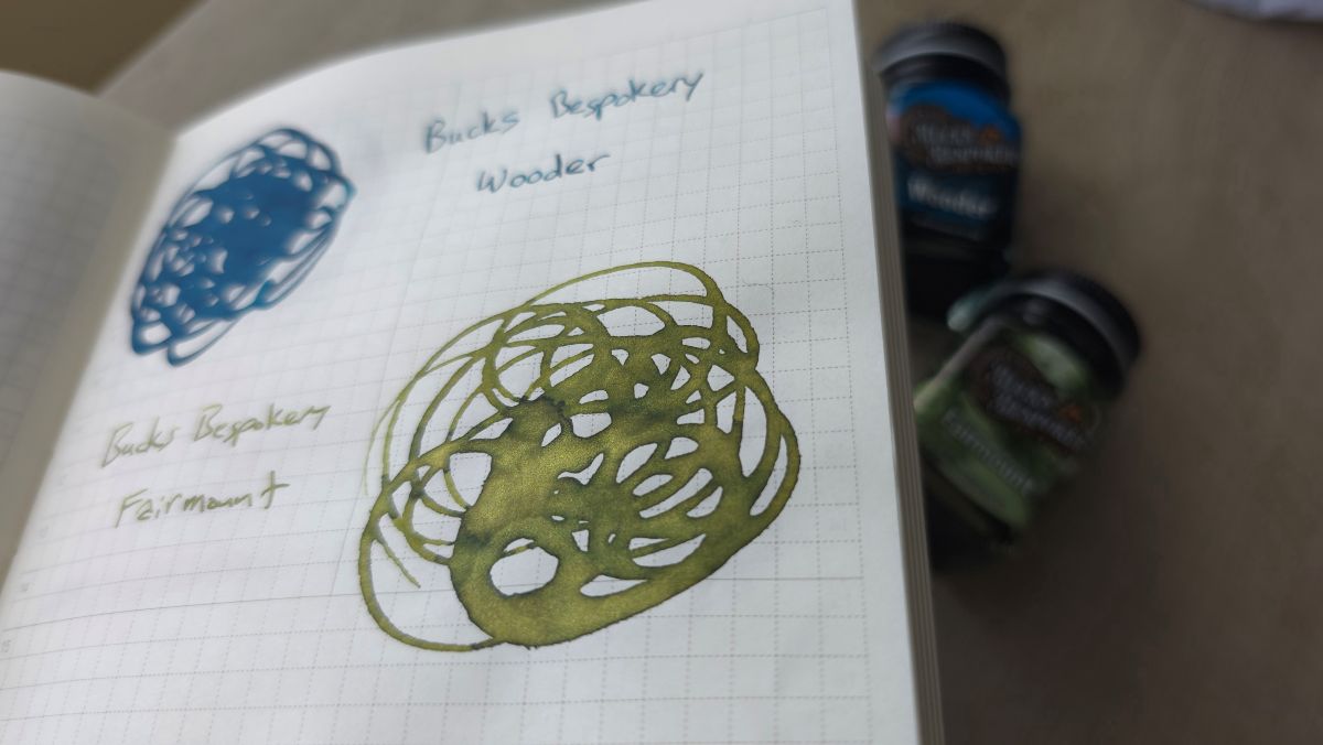 Closeup of a swirled swatch of Bucks Bespokery Fairmont ink in a medium yellow green shade with gold shimmer.