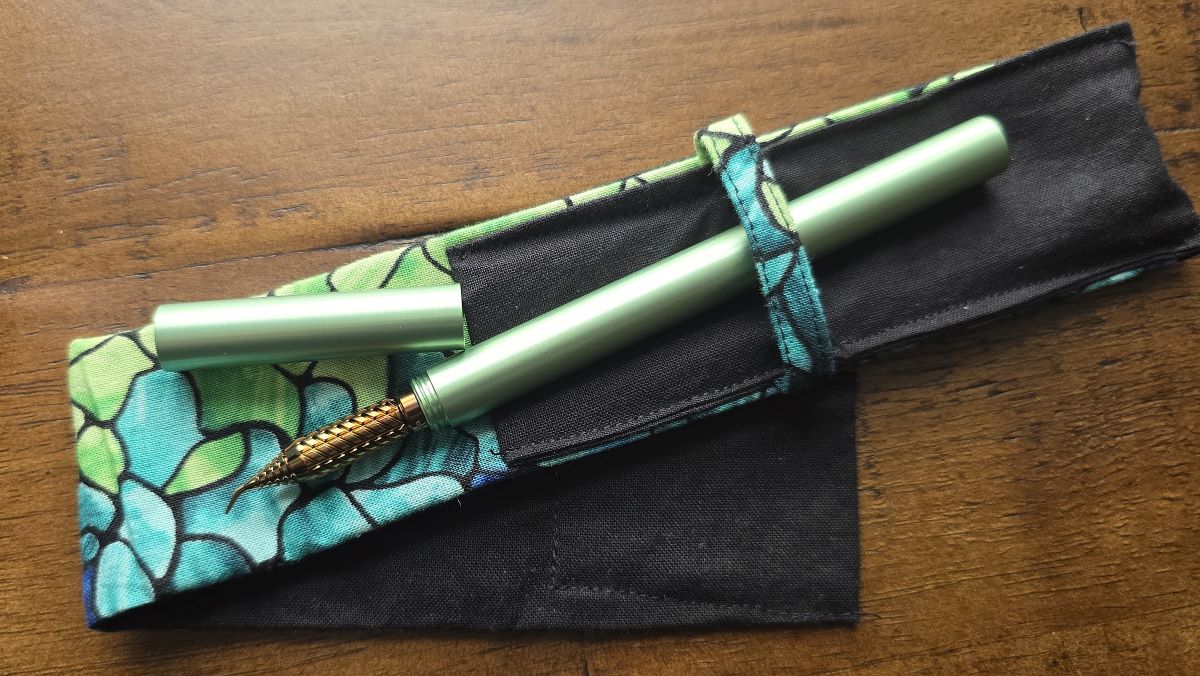 Uncapped green Drillog metal pen with yellow and brown fude Drillog metal dip nib.