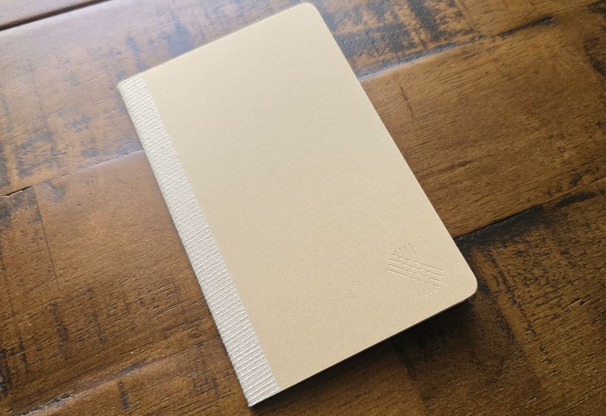 A Musubi pocket notebook with tape binding.