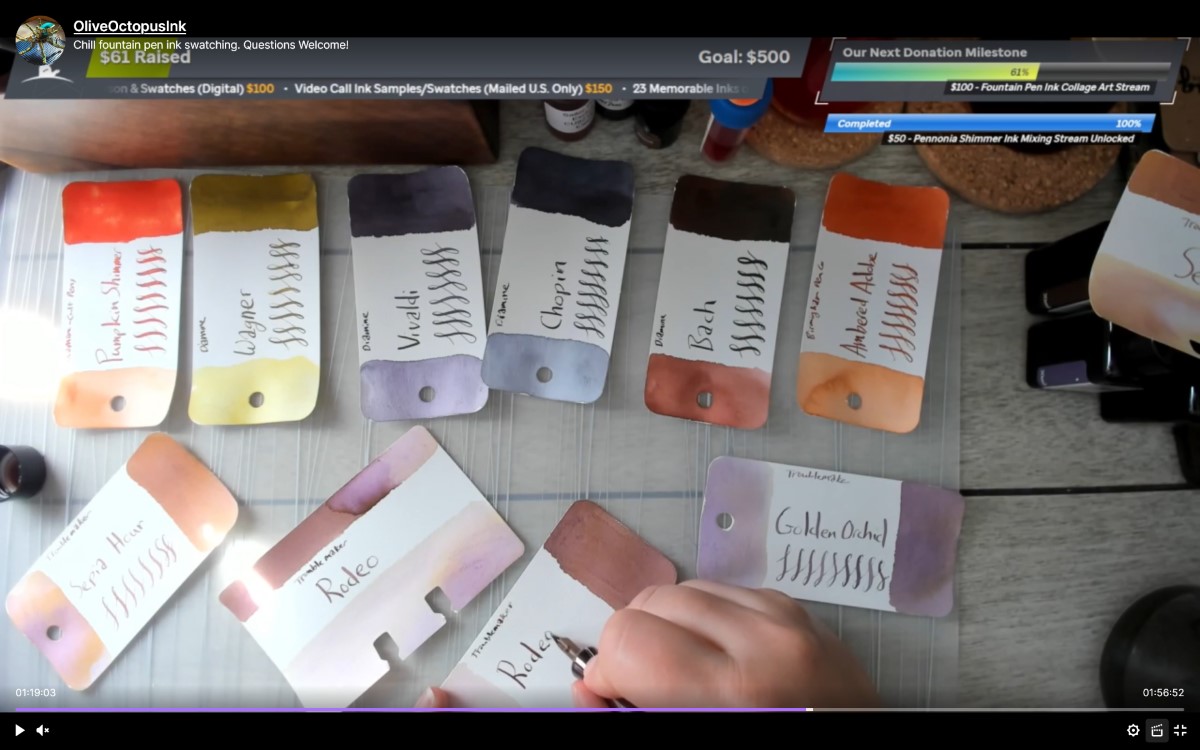 Screenshot of a Twitch VOD of swatching inks on Col-o-dex and Col-o-ring cards including Troublemaker inks Sepia Hour, Golden Orchid, and Rodeo, a few of the Diamine music series inks, and more.