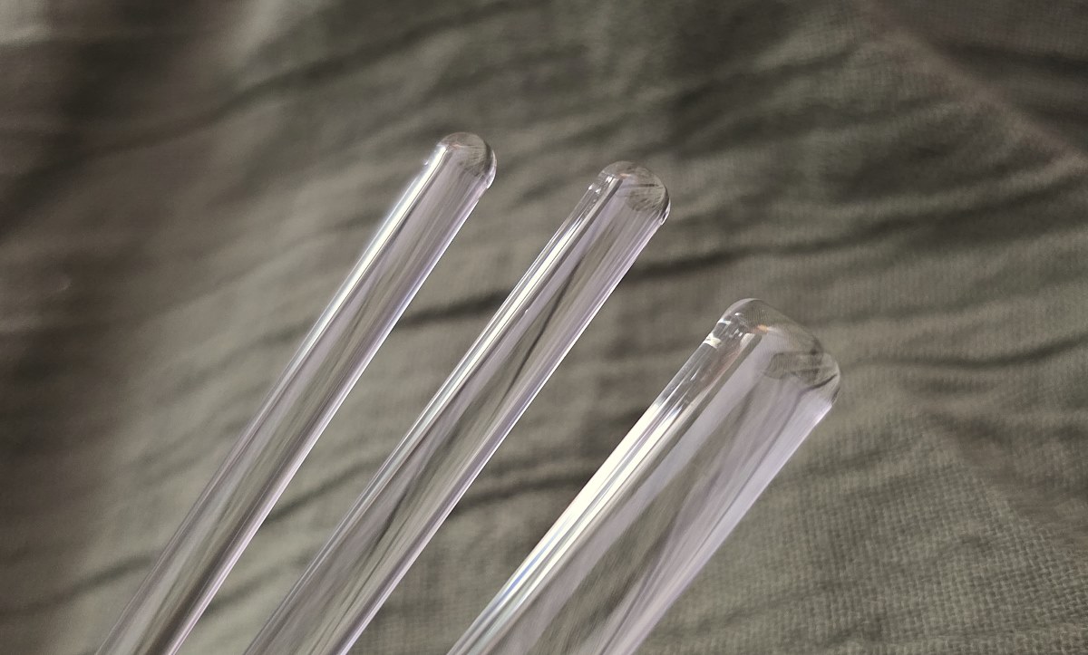 The ends of three glass stir rods, one 5mm, one 6mm, and one 10mm in diameter.