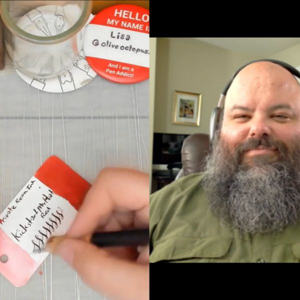 Screenshot of a video with a split screen showing a hand writing with a dip pen on a swatch card for a red ink on the left, and the interview host on the right.